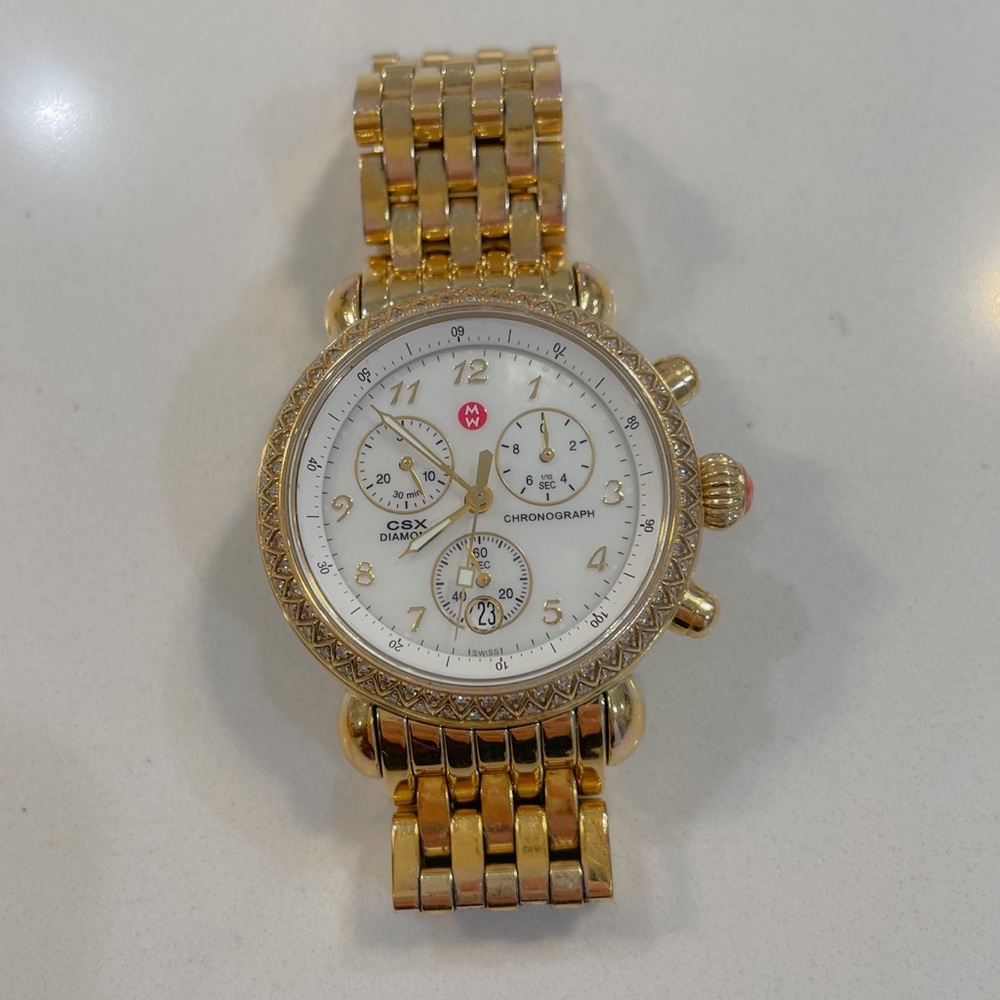 Michele CSX Gold watch with diamond bezel.